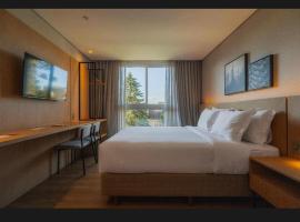 Quarto em hotel 4 estrelas GOLDEN TULIP, מלון בCanela