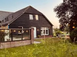 Koggel & Cottage -sfeervolle cottage met houtkachel & fiets oplaadpunt