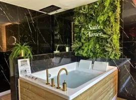 La Suite Aimée - Espace relaxant avec balnéo