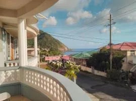 Hillside home with sea views close to Roseau