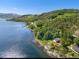 Cozy cabin by the waterfront, tranquility, nature, and fjords