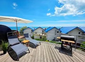 Подвійний котедж з терасою біля моря Совіньон