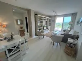 Condo with golf course views, pool and terraces
