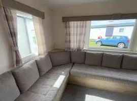 Homely caravan with side decking at Pakefield Holiday Park, Suffolk ref 68071CR