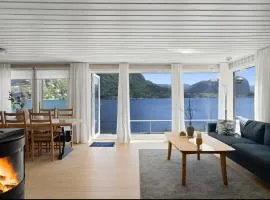 Cozy cabin by the waterfront, tranquility, nature, and fjords