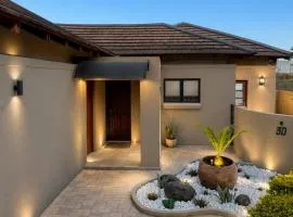 Stylish Riverside Home with Pool, Braai & Wi-Fi