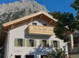 Karls Mittenwald - Design Apartments mit Alpenblick & Tagesbar im Herzen von Mittenwald