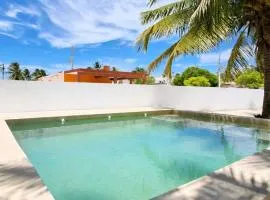 Room with art, pool, beach club