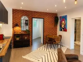 Brick - Loft design avec parking privé