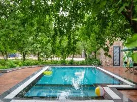 Hathnoda Bagh Cottage within a Mini Resort with Open Shower, Shared Pool, Restaurant, Sit Out & Garden