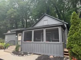 Screened porch pt water views hot tub walk to Saug