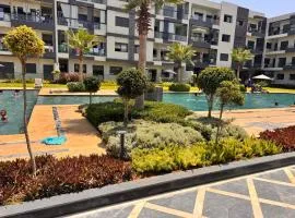 Beachland Mansouria, Charmant appartement vue sur piscine, accès plage et parking