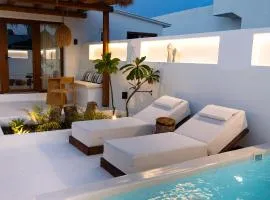 Sea Whisper Suites with private Cycladic patio and heated pool - sea side