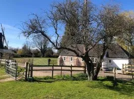 Tranquil grade II listed barn next to windmill