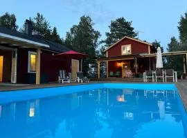 Two-story house with sauna, hot tub, and heated pool