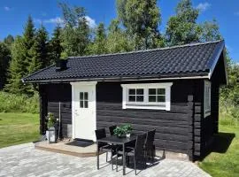 Mysig timmerstuga på dalagård