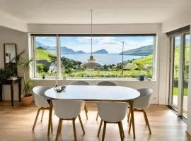 Panoramic Fjord Views in Modern Kvivik House