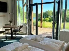Modernes Studio direkt am See - Strand vor der Tür
