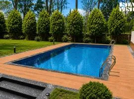 StayVista at Solitude in the Woods- 4BHK Villa with Private Pool, Kids Play area, Sohna