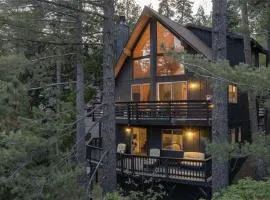 Glimmer Chalet Treetop A-frame cabin lake view