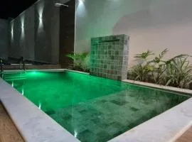 Casa Sol com piscina e 2 suítes com ar condicionado, pertinho da praia