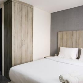 Minimalist Studio Room at Bintaro Icon Apartment By Travelio