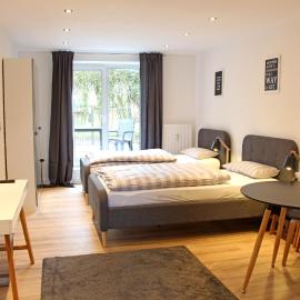 Moderne 1-Zimmer Wohnung mit Terasse, Küche, Bad mit Dusche, TV & WIFI, Hotel in Burgwedel