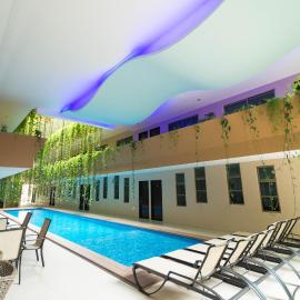 Palmarena Rooms & Residences - Long Stay Comfort with Parking, Sauna, Gym & Pool - Steps from 5th Avenue