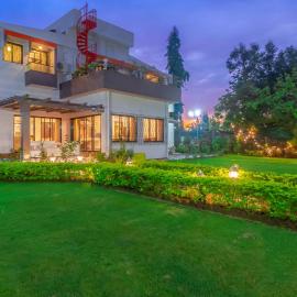 StayVista's Fairfield Villa - A green lawn and charming orchard await your retreat