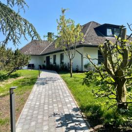 Hus inne Sünn, hotel a Welt