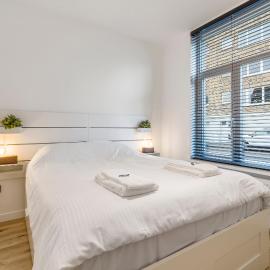 Cosy, furnished & renovated flat with outside lounge