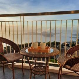 1 BR Cozy Farmhouse-Style Condo with Balcony & Taal View at Wind Residences