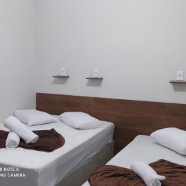 Pousada Quarto com ventilador,ar frigobar e garagem