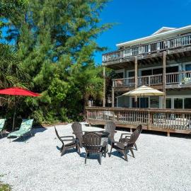 You can't get closer to the beach than this beachy 3 bedroom condo