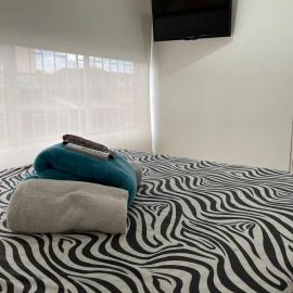 Lindos apartaestudios y habitaciones en Ibague, viešbutis mieste Ibagė