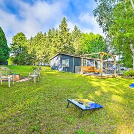 Riverfront Home w/ Dock ~ 6 Mi to Cheboygan!, hotel u gradu Šebojgan