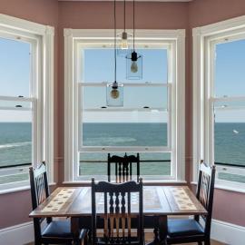 Stylish Beachfront Luxury Apartment, Sweeping Ocean Views and Log Burner