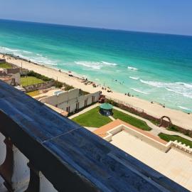 Panorama Apartment with a charming sea view near Alexandria and Burg ElArab Airport with Free Wifi شقة باطلالة ساحرة على البحر اول الساحل الشمالي واي فاي مجاني迷人海景公寓 免费无线网络, hotel in Alexandria