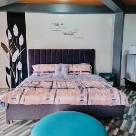 Rvenue apartelle, מלון בLucban