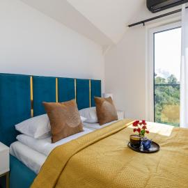Exclusive Apartment Różana with AC & Balcony View 1 km to the Beach by Noclegi Renters