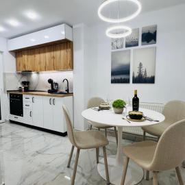 MarbleHome~Straja/Lupeni, hôtel à Lupeni