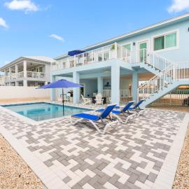 Blue Pearl New Waterfront Haven with Heated Pool ,70 Foot Dock, and More!