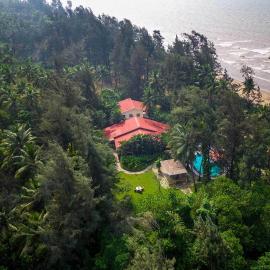 Sea Breeze by StayVista - Beachside bliss with a splash of creativity with Pool, gazebo, lush lawn, and an artistically inspired house