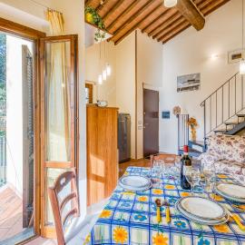 Tuscan Sun Duplex with Balcony and Shared Pool - Happy Rentals