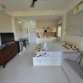 INATO SUITES Rm 1 1 queen bed and a pullout sofa bed