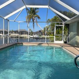 Relax with nature in our Waterfront 4 bedroom -HEATED POOL HOME-KING BED