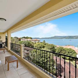 Remodeled Top-Floor Condo with Stunning Wrap-Around Balcony Offering Mountain, Ocean & Marina Views