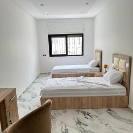 Chambre à Agdal Rabat dans un appartement partagé -two single beds-, hotel em Rabat