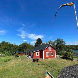 Majas Backe on a island with boat, hotel Hammarlandban
