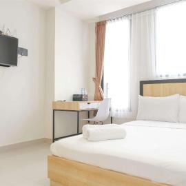 Minimalist and Homey Studio at Evenciio Margonda Apartment By Travelio